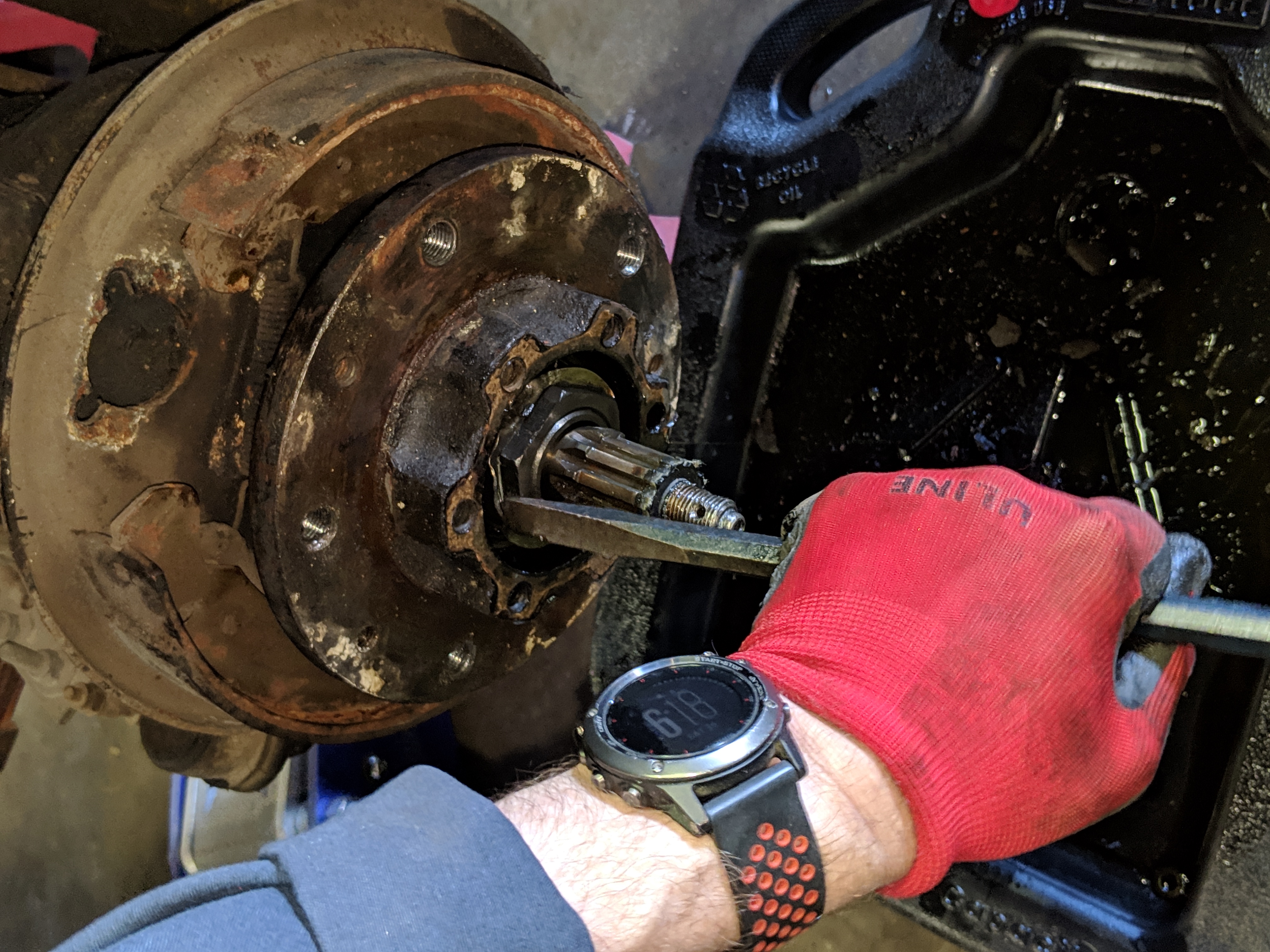 Flattening the tabs on the lock washer