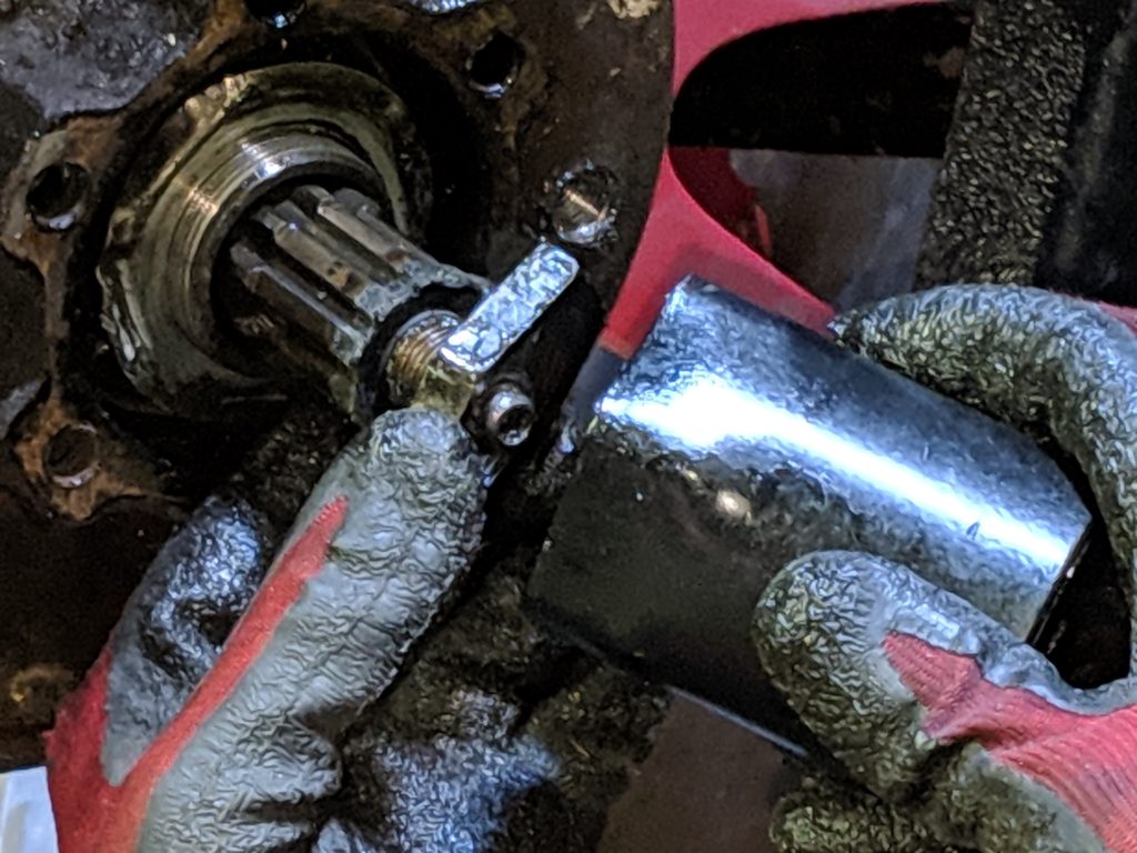 Close-up of the hub nut and removal tool